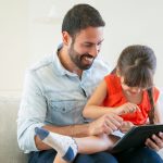 A child enjoys a learning app for kids on a tablet