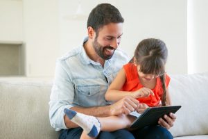 A child enjoys a learning app for kids on a tablet