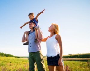 Parents with Child outdoors enjoying peace of mind