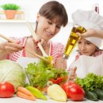 mom and daughter cooking healthy foods