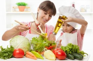 mom and daughter cooking healthy foods